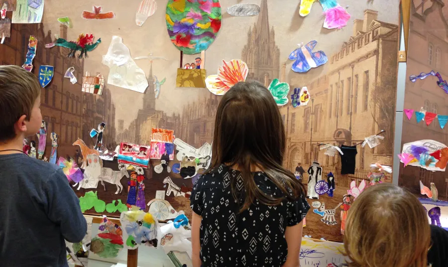 Children decorate a reproduction of The High Street, Oxford