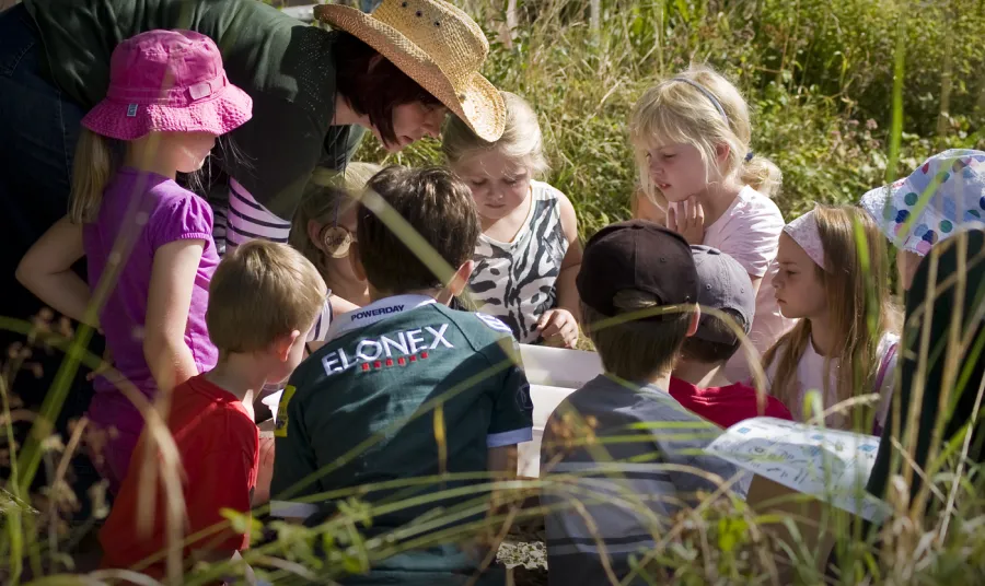 Young visitors explore with Claire Garrity, College Lake's environmental education manager 