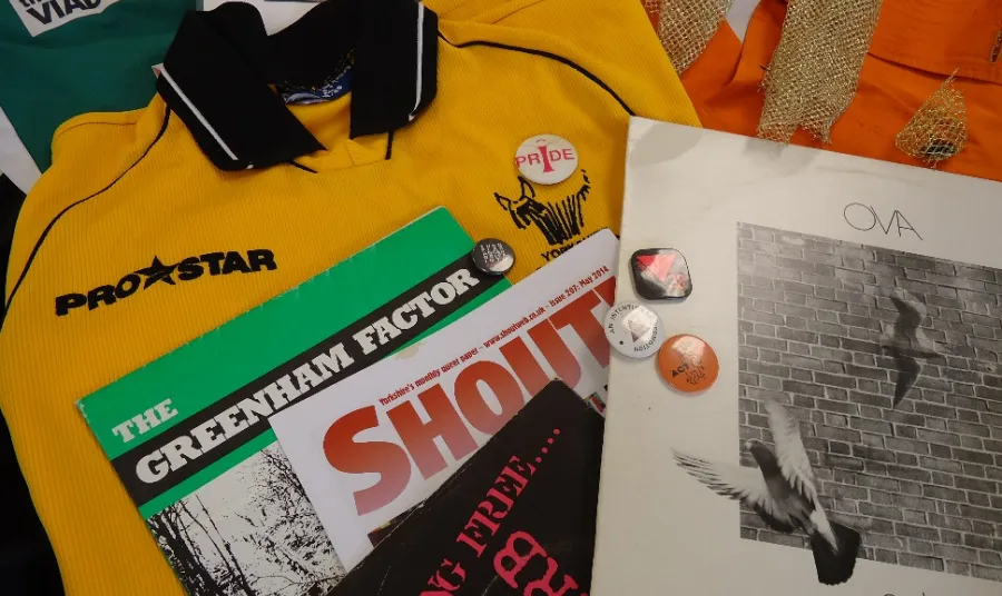 Archive materials including magazines, clothes and badges