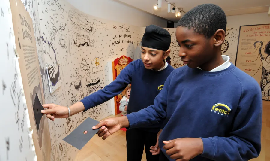 Schoolchildren enjoying the Seven Stories exhibition