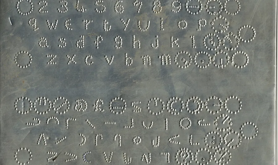 A moonboard used to teach blind people to read from the 1850s