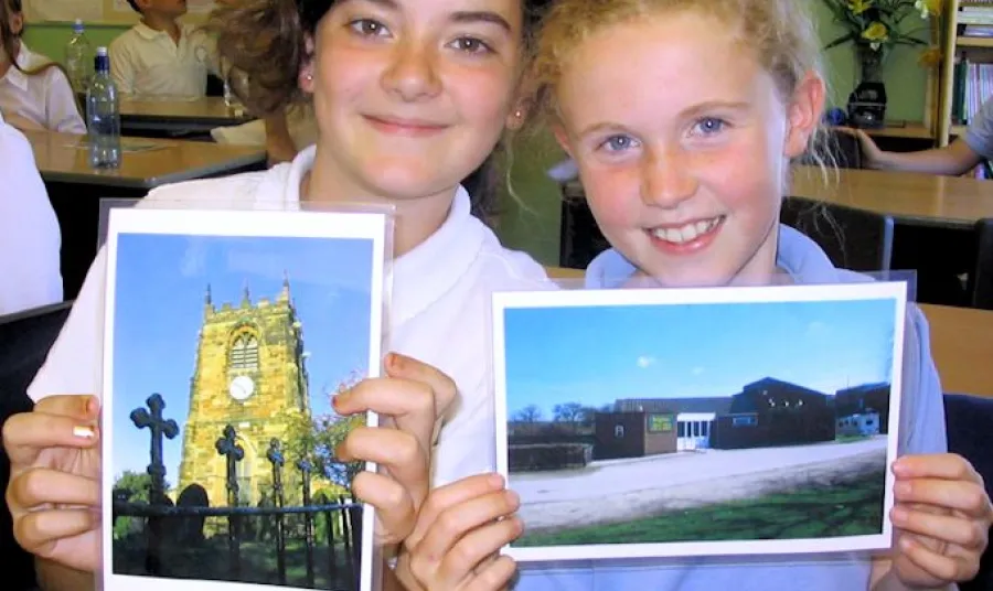 Children sharing photographs of Beighton