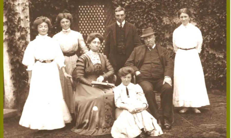 The Caldwell family posed outside a building c.1908