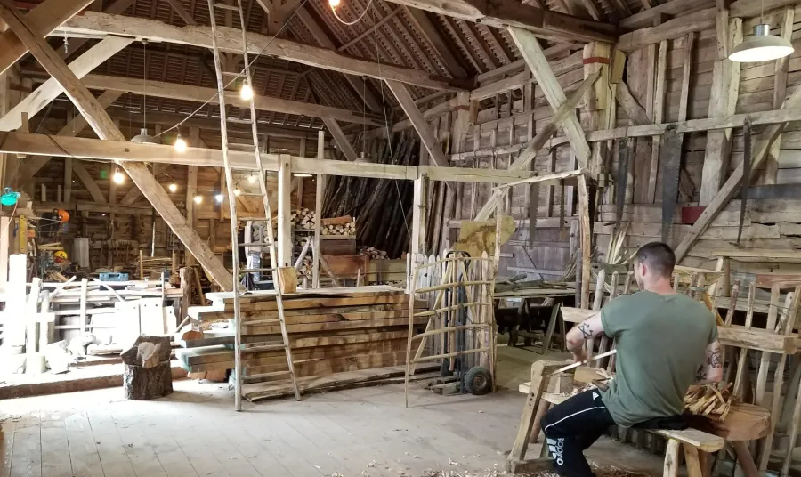 A wood worker in the Great Barn at Great Dixter