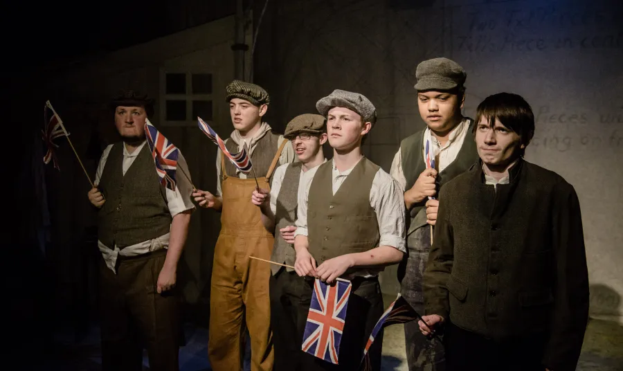 Actors performing 'Gas Girls'