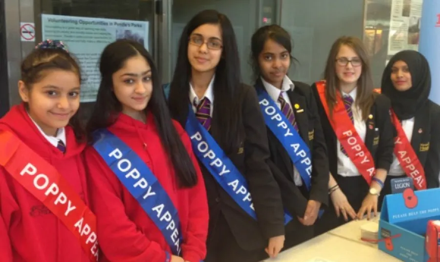 Young people sell poppies