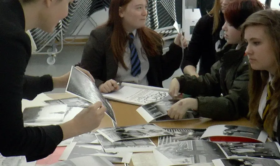 Students look at historic photographs