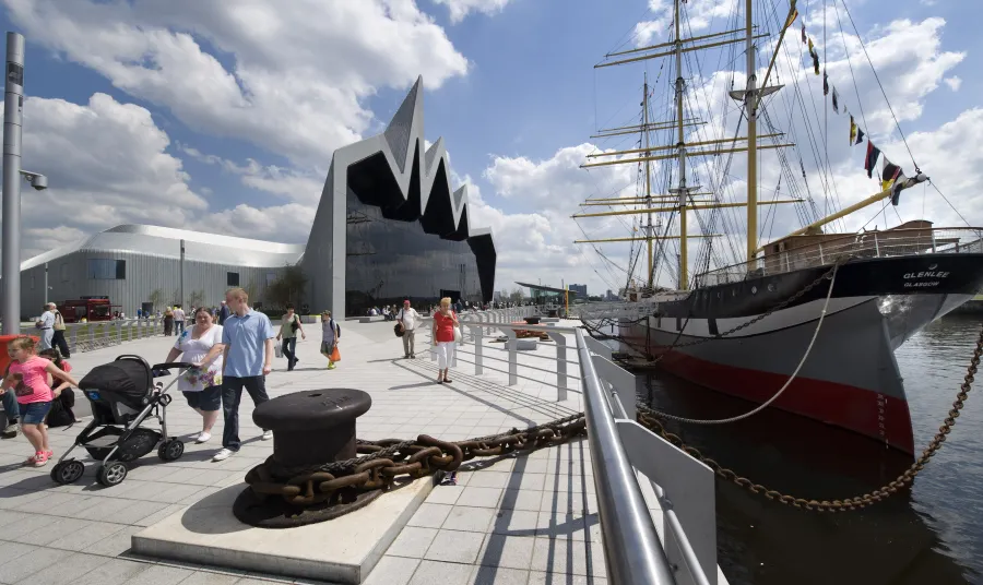 Visitors walk alongside Riverside Museum, Glasgow