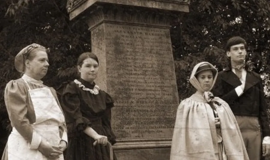 Black and white archive photo four people posing