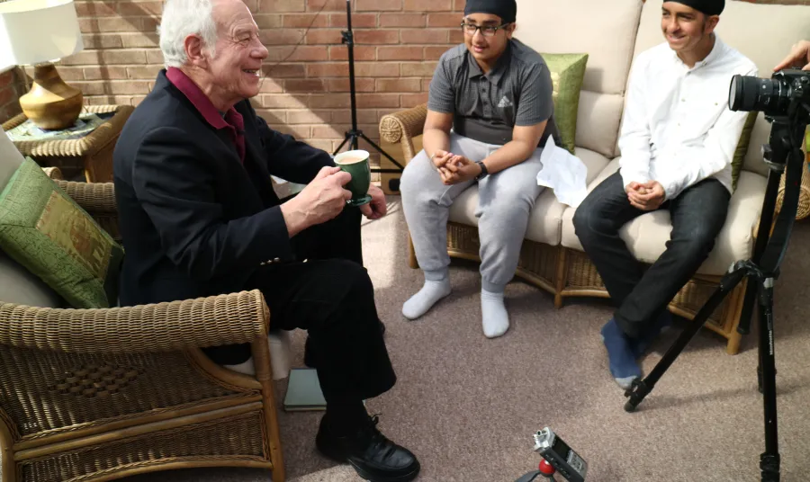 Young hockey players interview older people