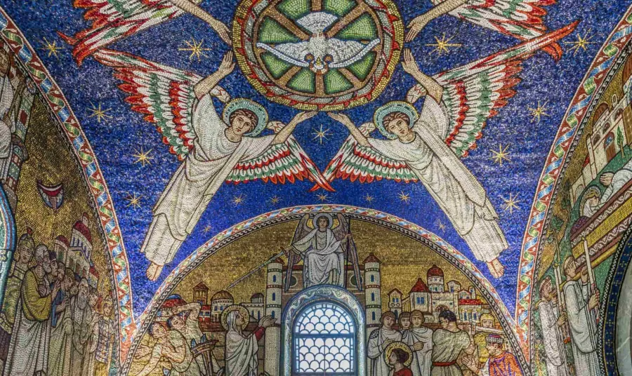 the ceiling of an apse in a church decorated with detailed mosaics showing angels and bible stories