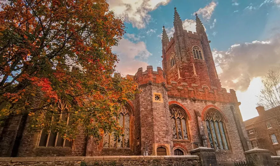 a church with a tower in autumn