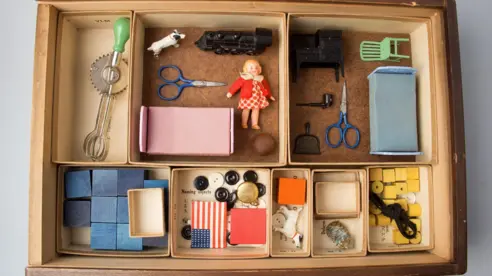 Photograph of various items in a wooden box