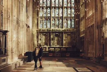 Two people are stood inside the Lady Chapel admiring the interior"