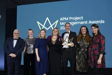 Members of the Future Parks Accelerator team stand on stage to receive the award