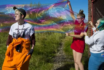 Young people with rainbow bubble