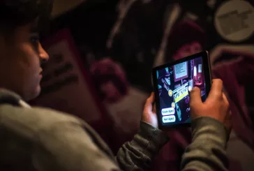 Person using tablet inside museum