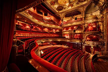 Inside a grand auditorium 