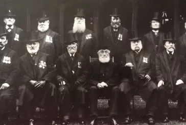 An old photograph showing a group of elderly men in formal dress