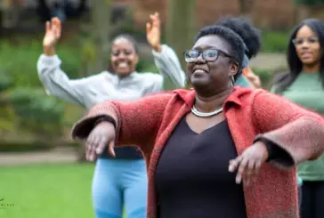 Photograph of women taking part in a physical activity in a park