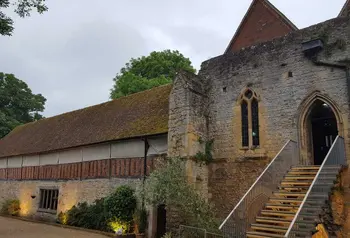 Abingdon Abbey building lit up at dusk