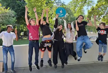Young people jumping in the air celebrating their Heritage Fund grant to restore their Hall