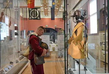 A re-enactor examines an exhibit at the Civil War Centre
