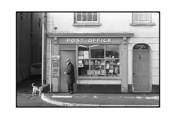 A man and his dog pictured outside a post office