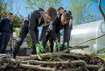 Students undertake habitat restoration on an allotment.