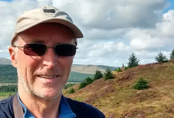 Alistair McNaught smiling in nature