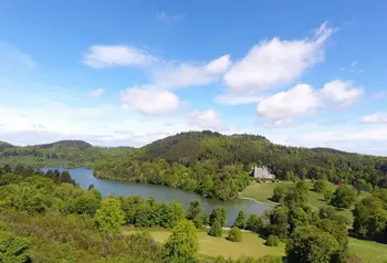 Panoramic view of Castlewellan Forest Park, with lake and castle visible on the hill