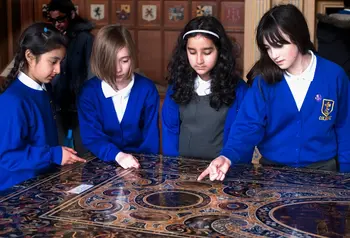 Children gathered around a table at a National Trust Property