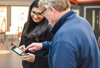 Two people looking at a phone