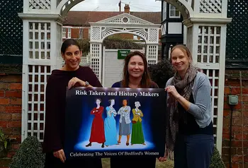 Women holding a sign