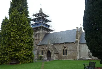 A church with scaffolding on its tower