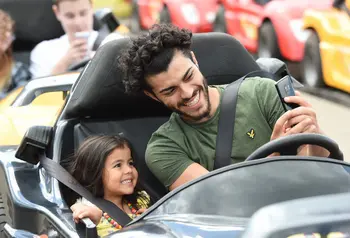 Two people in fairground ride