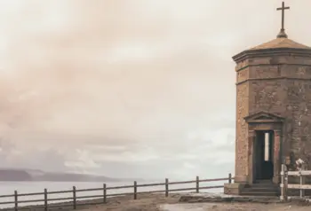 Octagonal brick structure with roof with a cross on the cliff tops above Bude in Cornwall.