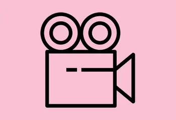 A black icon showing a film projector