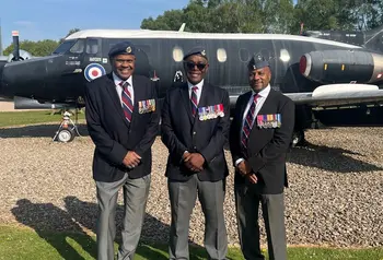 Donald Campbell and two of his fellow veterans stand together in front of a decommissioned RAF plane.