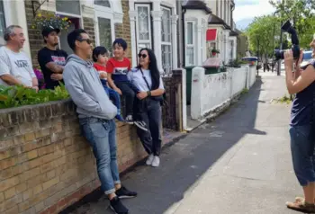 Newham family being photographed during Newham Heritage Month