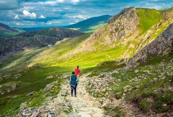 Two walkers on a trail in Snowdonia National Park