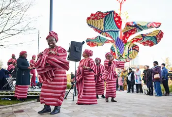 A group of people wearing Nigerian traditional clothes, celebrating the launch of Hibiscus Rising.