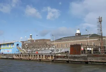 Dockside buildings under a blue sky