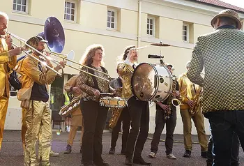People are together playing instruments outside