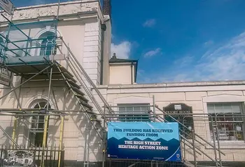 The exterior of a historic building with scaffolding on it.
