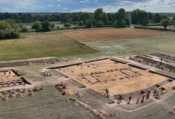 An aerial photo of an archaeological dig in a field