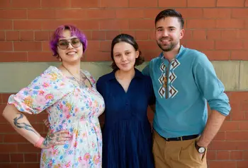 Three people working on the Roma Heritage Project.