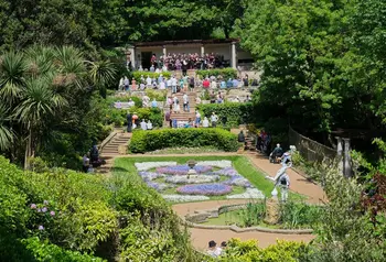 The Scarborough South Cliff gardens on a sunny day, with visitors enjoying an opening event performance