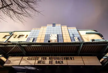 The art deco facade of the Strand Arts Centre with cinema lettering reading 'Closed for refurbishment. We'll be back"