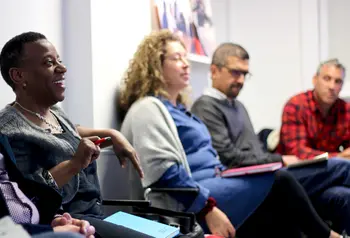 A group of people taking notes in a workshop